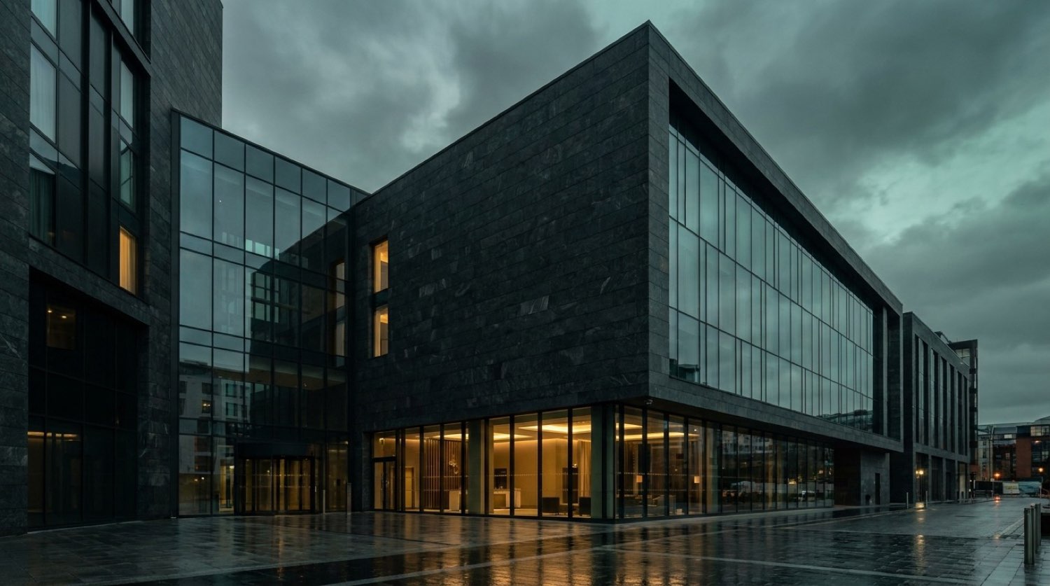 PartyQueueCrew exterior at dusk — dark glass facade with restrained warm interior glow, Leeds city centre